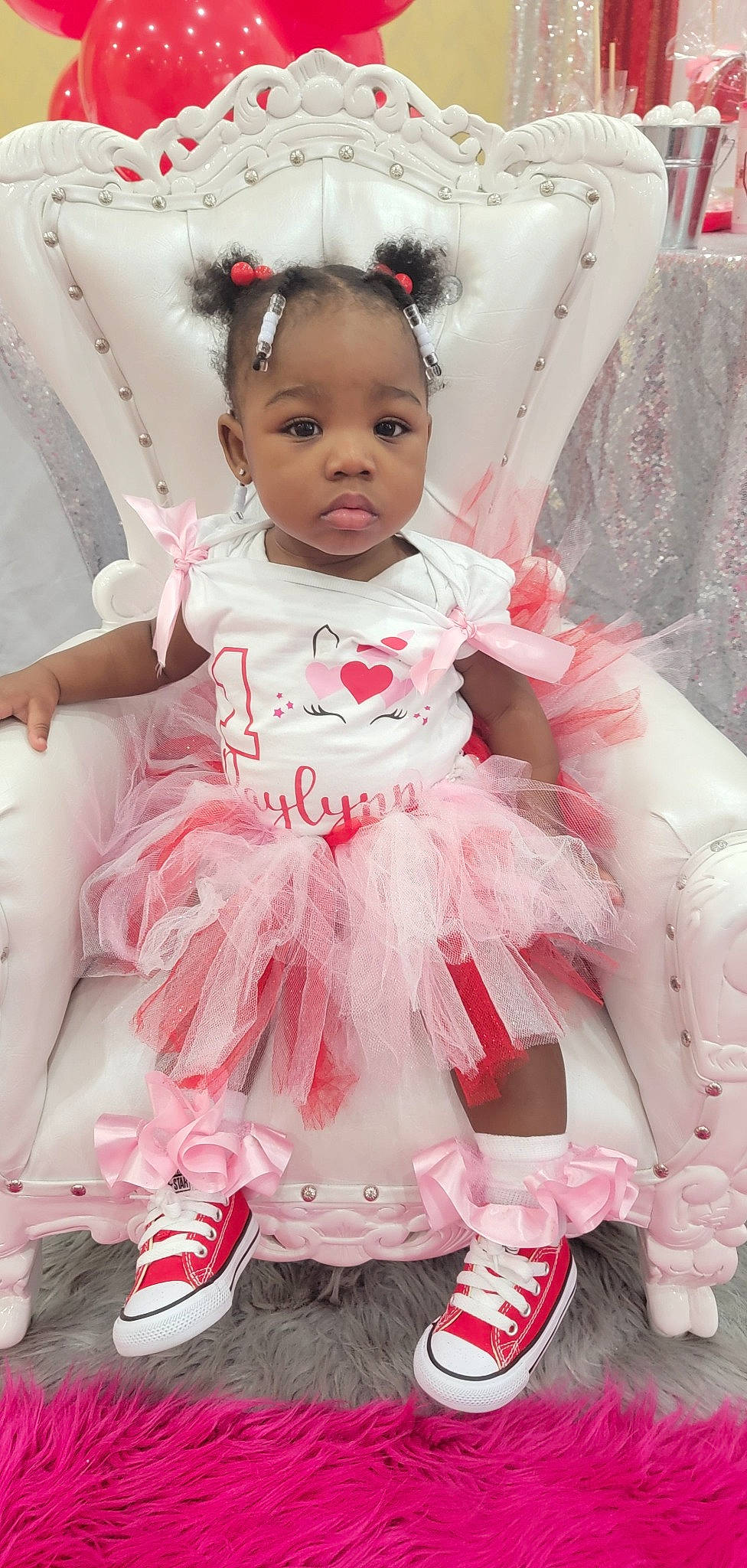 Raylynn joined the competition — help win amazing prizes! baby, baby_toddler_clothing, day_dress, dress, embellishment, eyelash, face, happy, headgear, headpiece, iris, magenta, person, pink, red, ruffle, skin, sleeve, textile, toddler