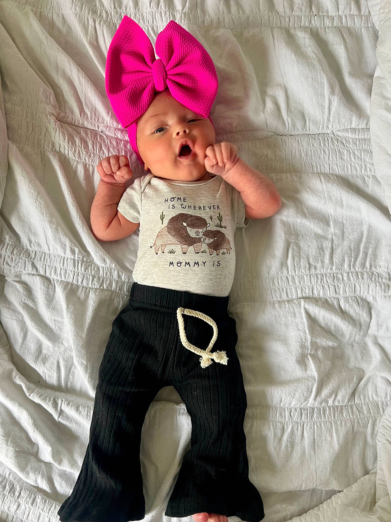 Sadie is registered to the contest to win money with this photo: baby, baby_toddler_clothing, cap, comfort, cool, face, finger, hand, happy, headwear, human_body, magenta, outerwear, person, pink, shoulder, sleeve, t_shirt, textile, thigh