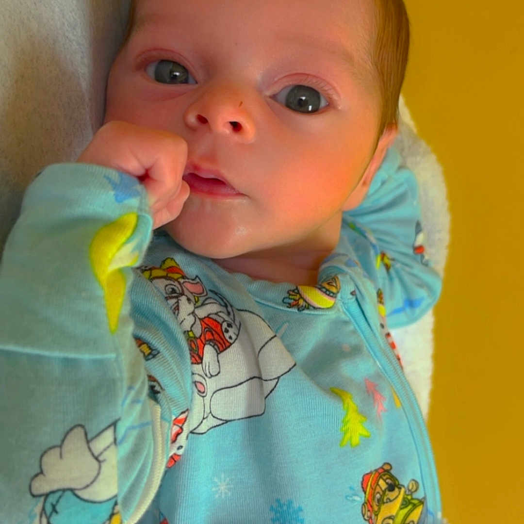 Tyler joined the competition — help win amazing prizes! baby, blanket, bodypart, clothing, coat, cushion, doll, face, finger, furniture, hand, head, homedecor, jacket, newborn, person, photography, portrait, towel, toy