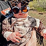 Paisley joined the competition — help win amazing prizes! baby, child, sunglasses, leopard_print, bow, outdoor, person, hand, fashion, shirt, portrait, accessory, animal_print, cute, face, sunny, fringe, adult, holding, nature