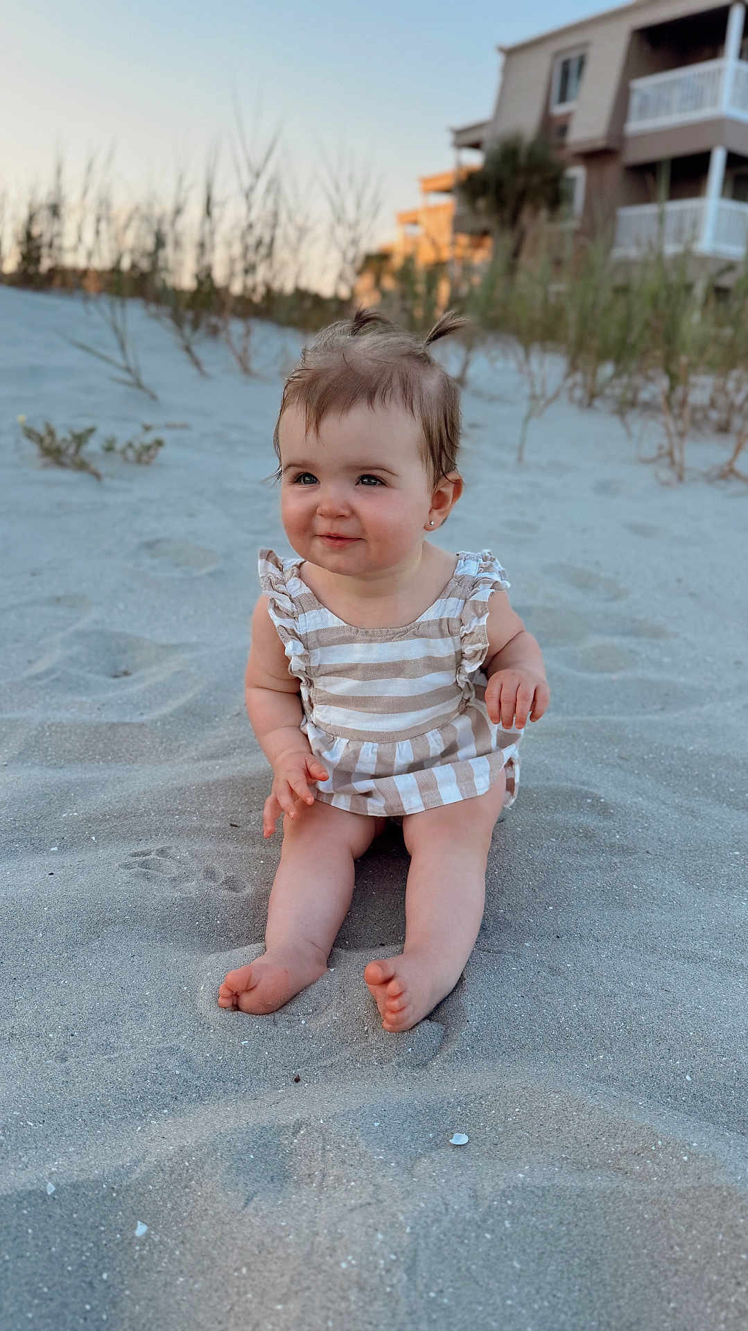 Paisley joined the competition — help win amazing prizes! baby, child, sand, beach, smiling, sitting, pigtails, striped_clothing, outdoor, daylight, footwearless, cute, person, portrait, nature, happy, young_child, skin, head, background