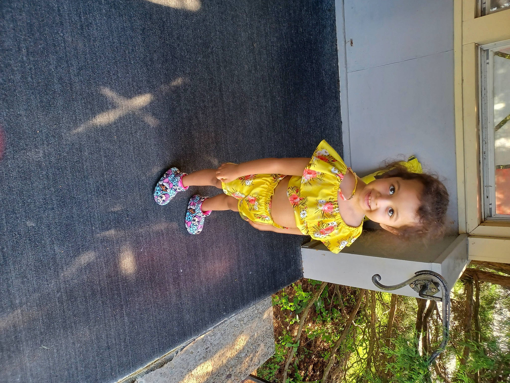 Malaiya is registered to the contest to win money with this photo: asphalt, baby, baby_toddler_clothing, child, city, concrete, foot, fun, happy, human_leg, joy, leisure, person, road_surface, sandal, sidewalk, thigh, toddler, vacation