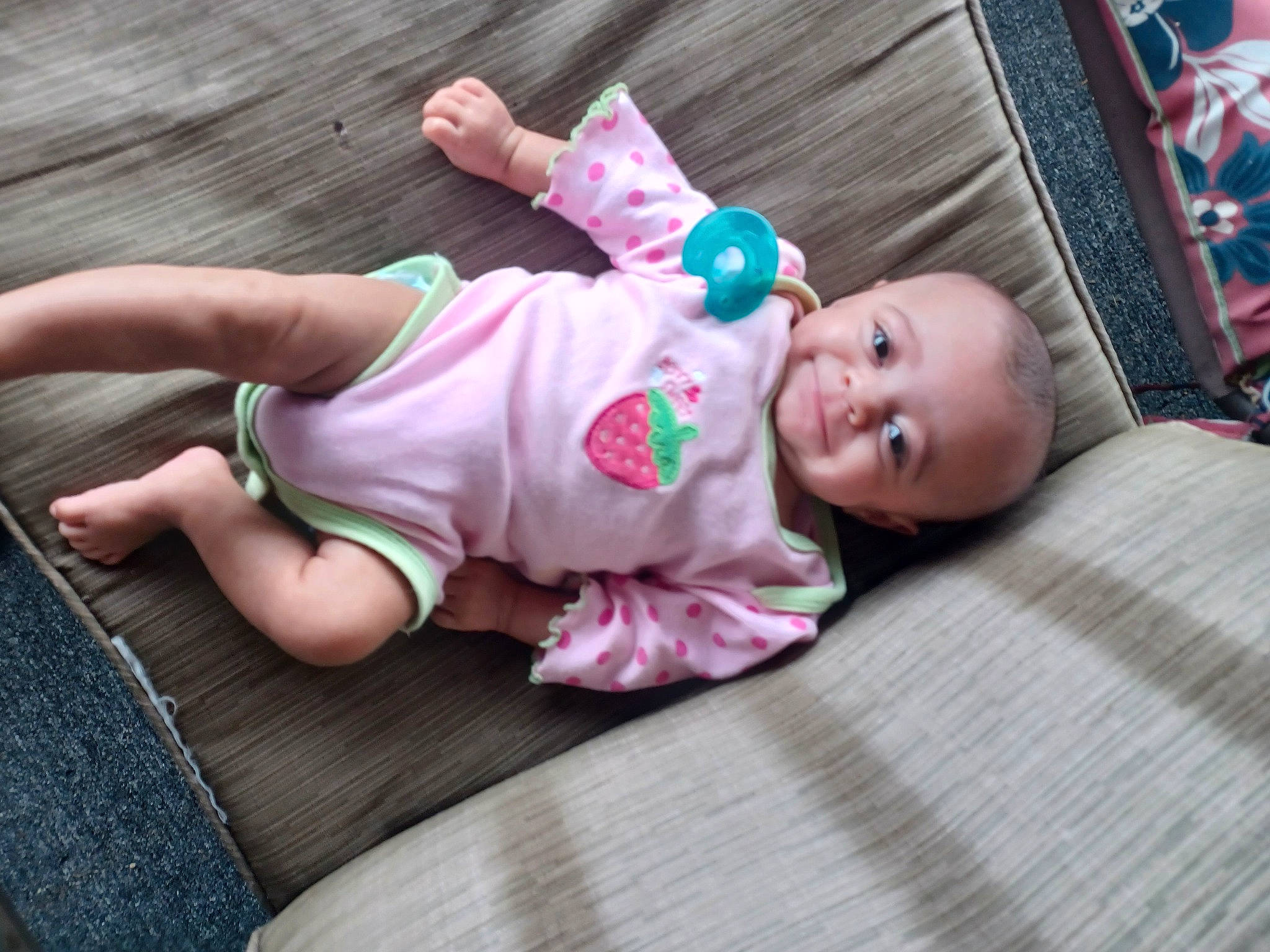 Brielle is registered to the contest to win money with this photo: baby, baby_products, baby_toddler_clothing, cheek, child, comfort, eye, flooring, foot, fun, grass, hardwood, hat, linens, person, sitting, skin, sleeve, smile, toddler
