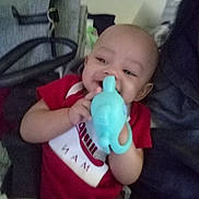 Kevontae joined the competition — help win amazing prizes! accessories, baby, ball, bed, bodypart, clothing, couch, cushion, face, finger, furniture, hand, head, homedecor, indoors, person, photography, portrait, t_shirt, toy