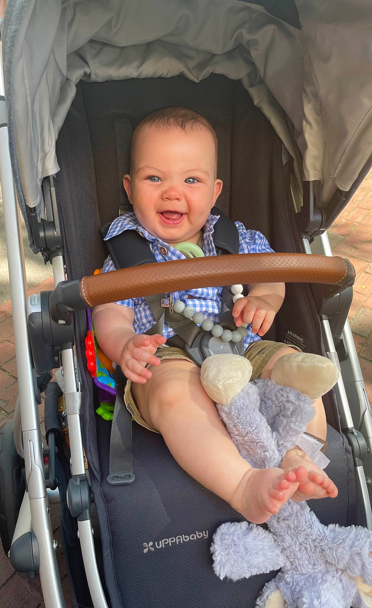 Jake is registered to the contest to win money with this photo: auto_part, baby, baby_carriage, baby_products, car_seat, chair, child, comfort, fun, human_leg, lap, leisure, person, product, shorts, sitting, skin, smile, thigh, toddler