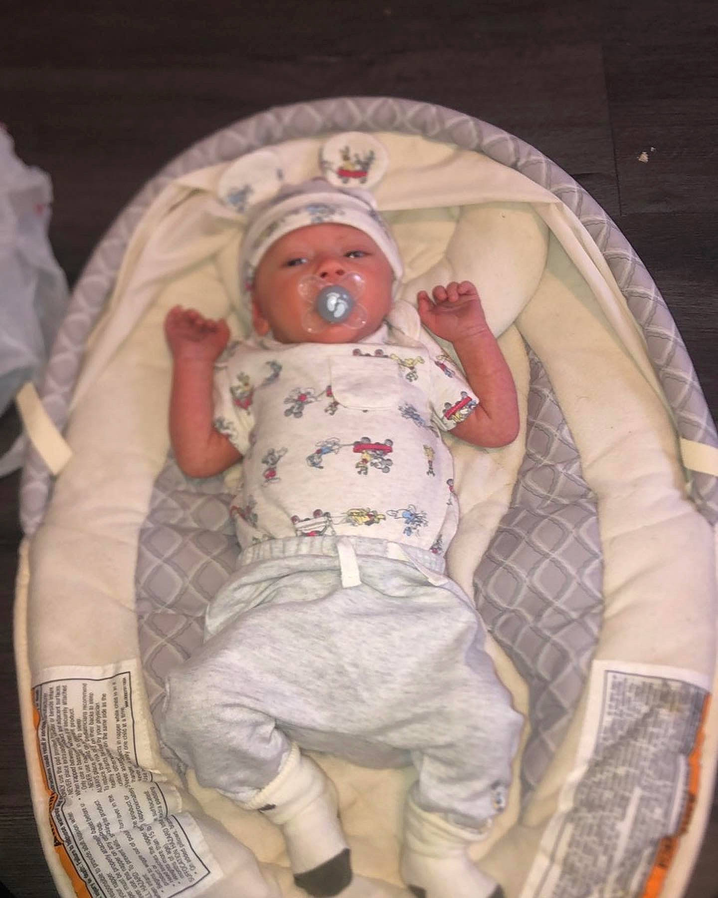 Malcolm is registered to the contest to win money with this photo: baby, baby_products, baby_safety, baby_sleeping, baby_toddler_clothing, baby_toys, bed, bedtime, cheek, child, comfort, eye, head, headwear, human_body, infant_bed, linens, mouth, person, skin