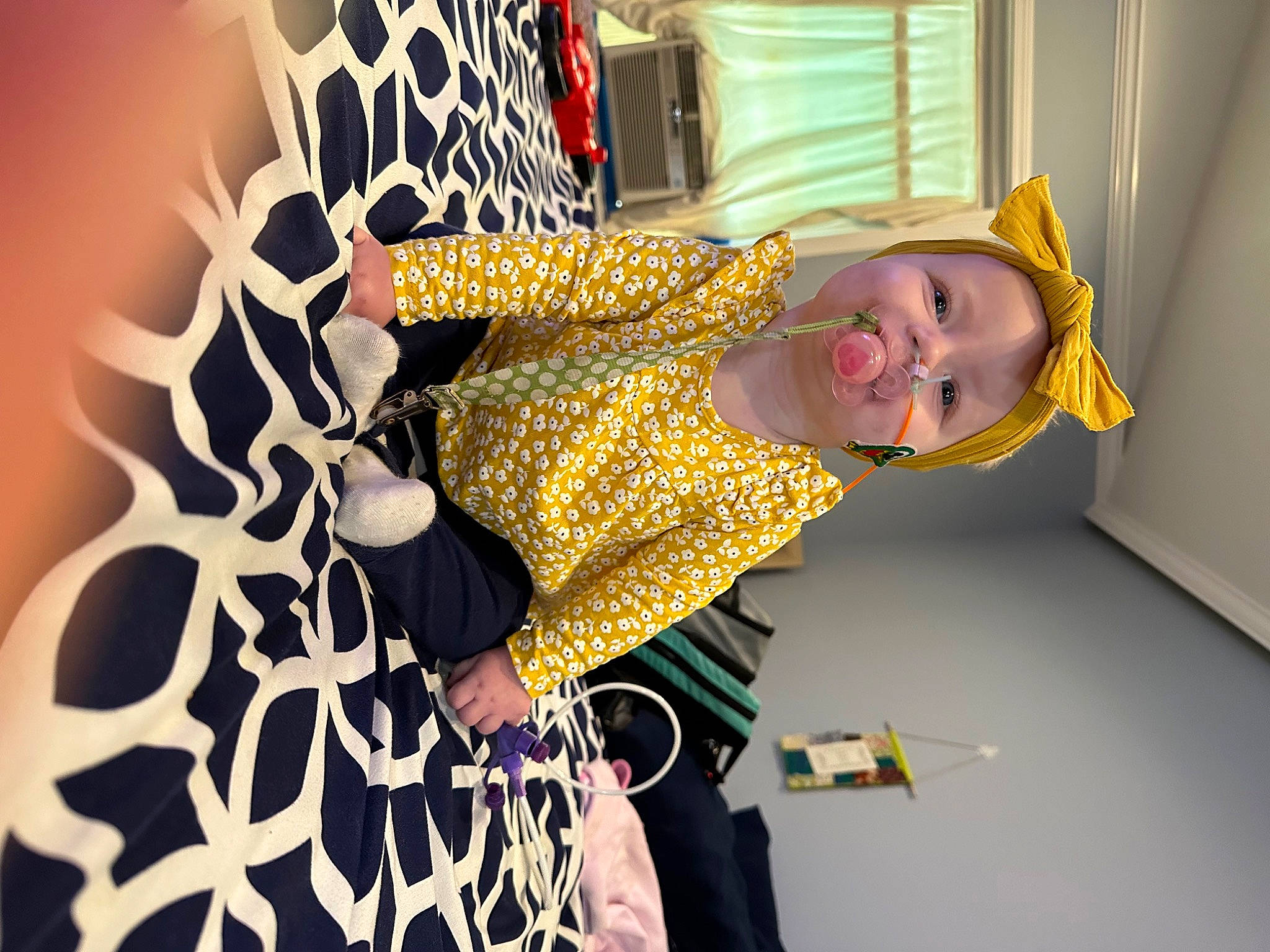 Arabella is registered to the contest to win money with this photo: art, costume, event, eyewear, fashion_design, fun, happy, magenta, pattern, person, room, smile, toddler, visual_arts