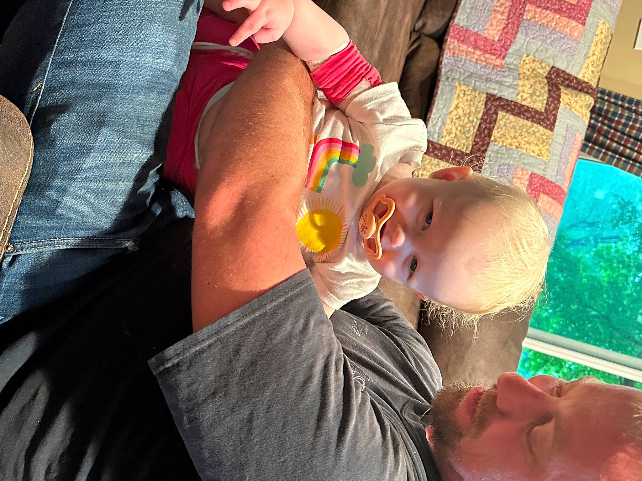 Arabella is registered to the contest to win money with this photo: abdomen, chest, child, eyewear, finger, fun, gesture, grass, happy, human_leg, knee, leisure, mouth, nail, person, room, sitting, sunglasses, t_shirt, thigh