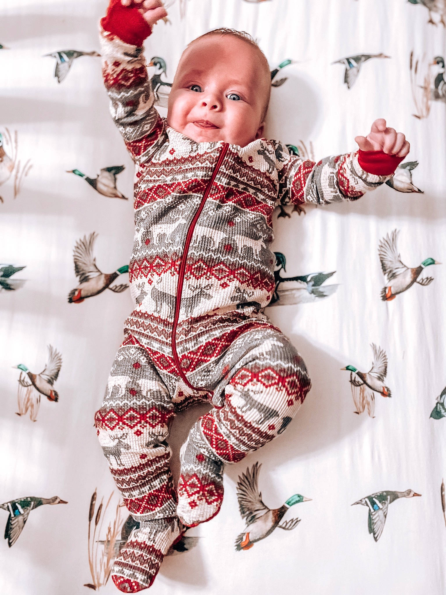 Bodie is registered to the contest to win money with this photo: arm, baby, baby_toddler_clothing, cheek, finger, gesture, hairstyle, hand, happy, head, joint, person, pink, red, skin, sleeve, smile, t_shirt, textile, toddler