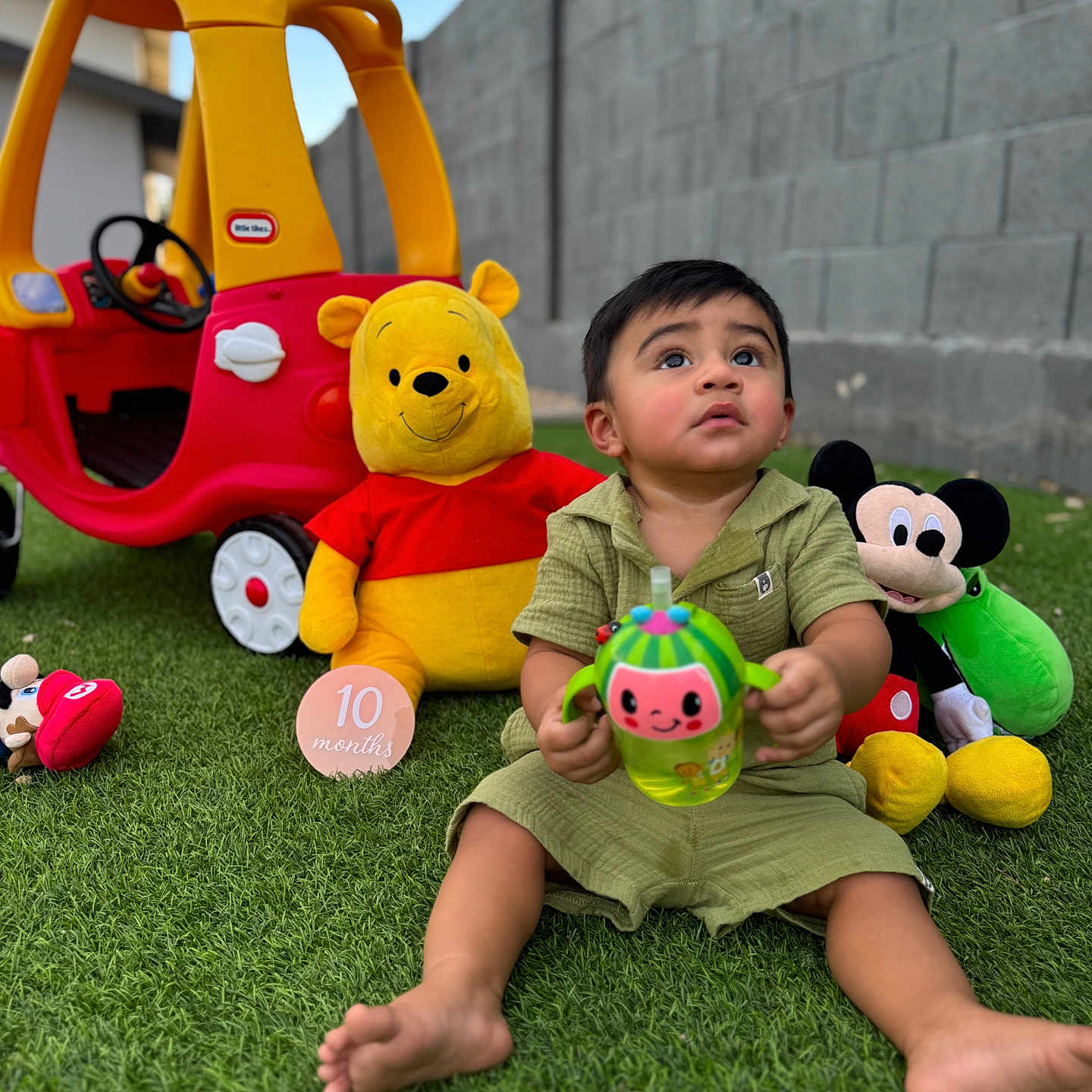 Alan is registered to the contest to win money with this photo: baby, ball, face, football, grass, head, lawn, machine, outdoorplayarea, outdoors, person, photography, plant, playarea, portrait, soccer, soccerball, sphere, toy, wheel