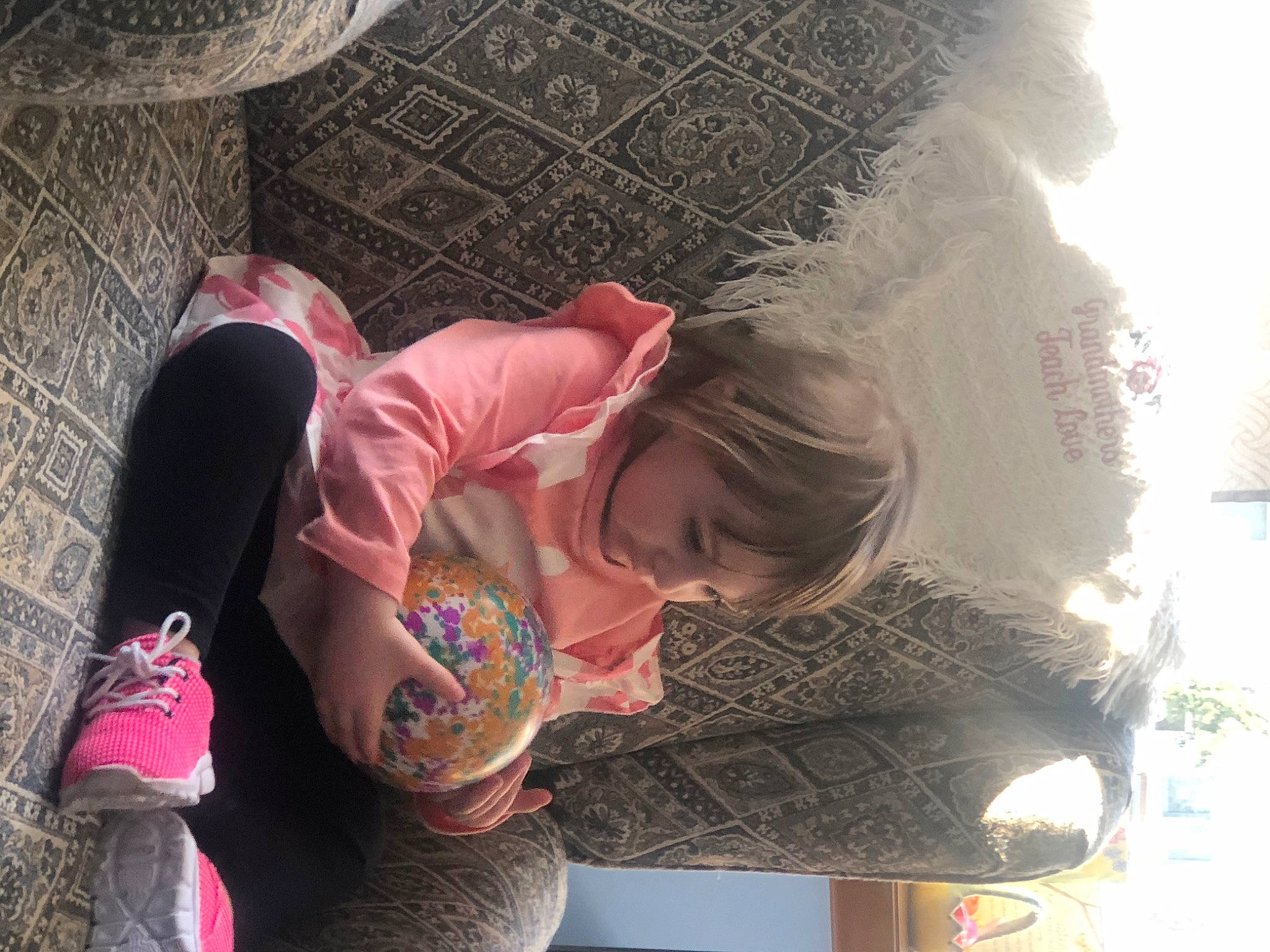 Isabella Rose is registered to the contest to win money with this photo: automotive_exterior, child, eyewear, fun, grass, happy, human_leg, leisure, person, play, recreation, sitting, sunglasses, t_shirt, thigh, toddler, tree, vacation, winter