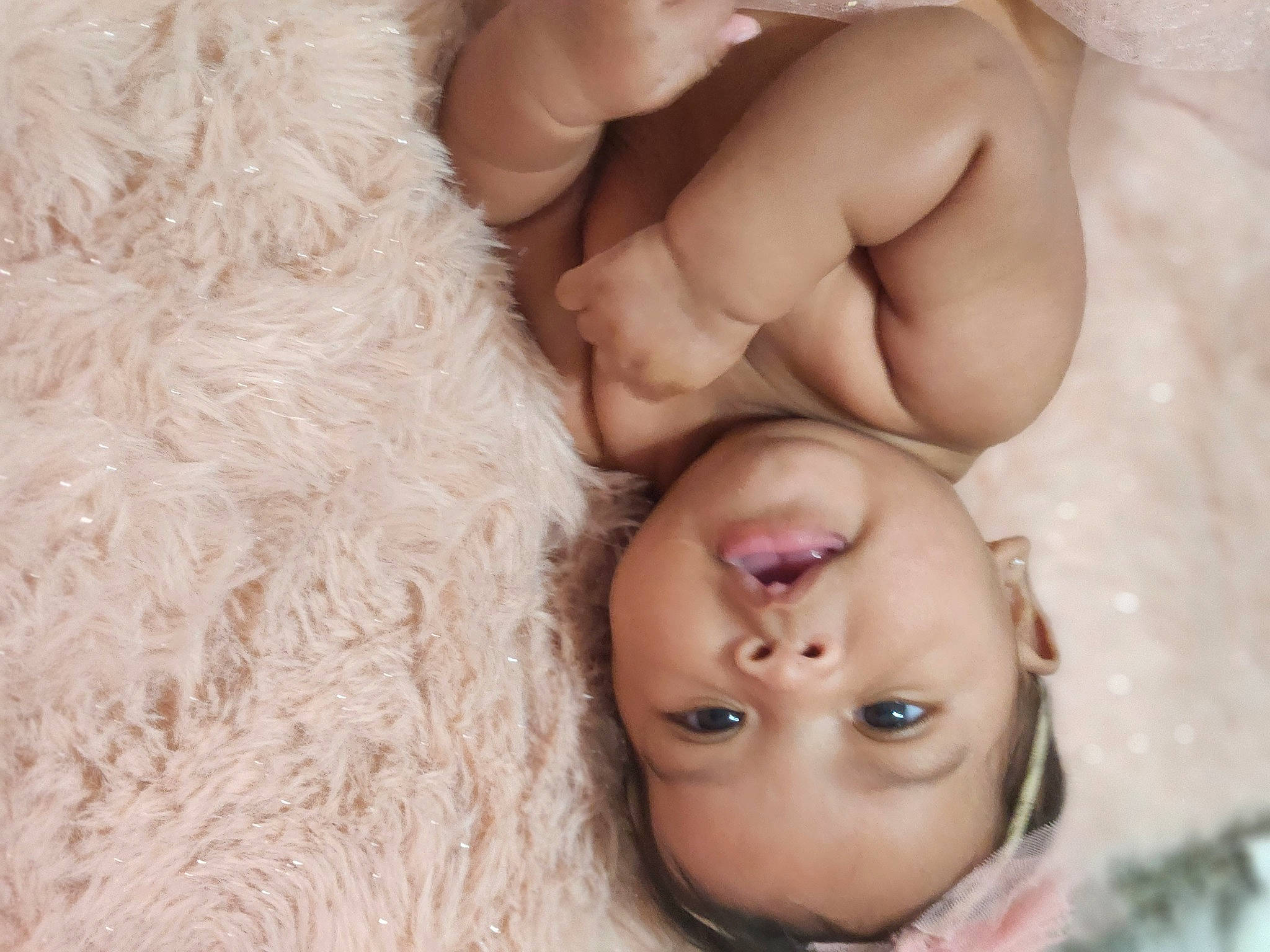 Kennedy is registered to the contest to win money with this photo: abdomen, baby, chest, child, close_up, comfort, eyelash, fur, gesture, happy, linens, mouth, nail, neck, nose, person, skin, stuffed_toy, thumb, toddler
