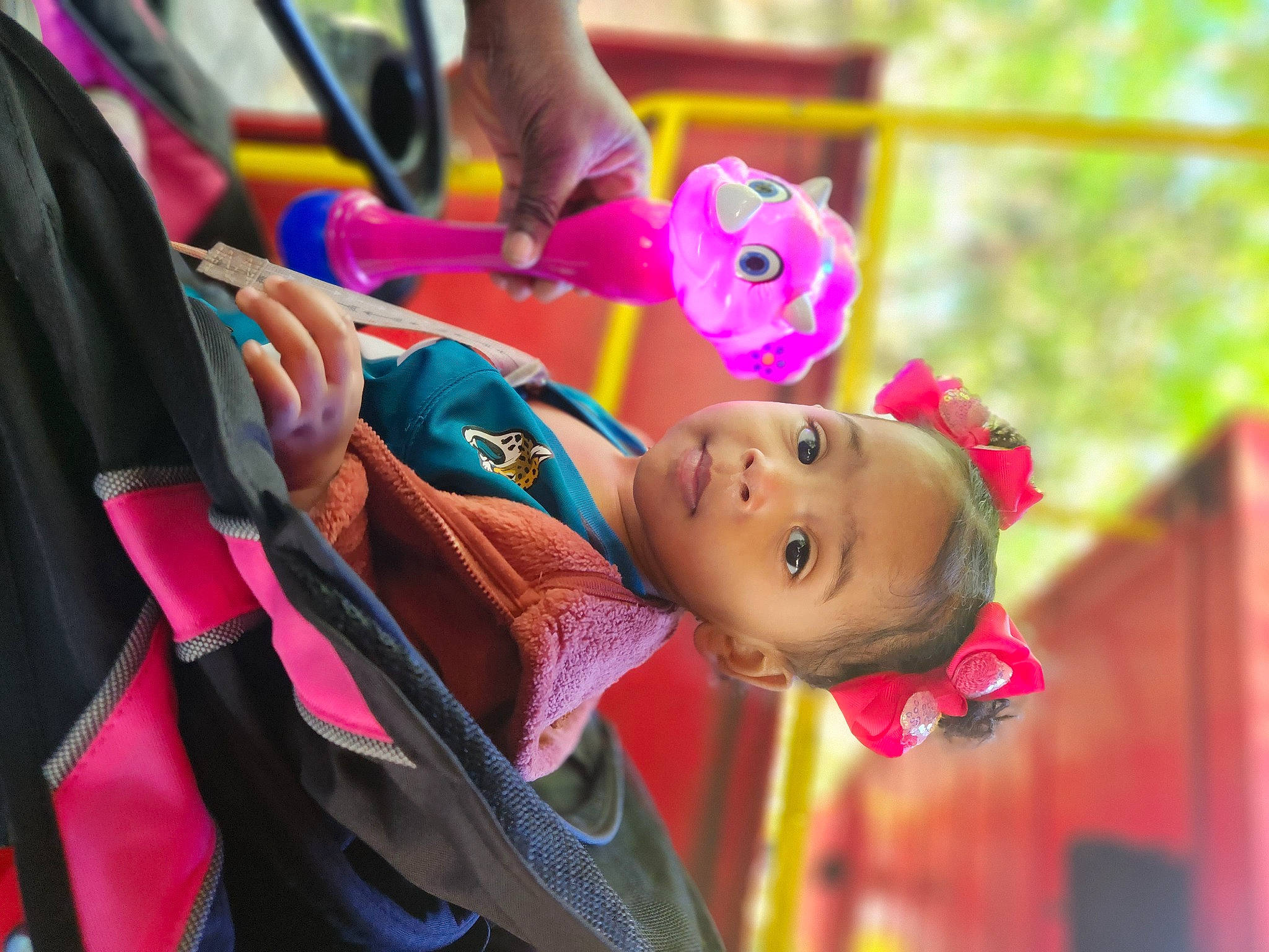 Kenley joined the competition — help win amazing prizes! baby, baby_products, child, event, festival, fun, happy, leisure, magenta, person, pink, play, public_event, purple, recreation, smile, toddler, tradition, tree, vacation