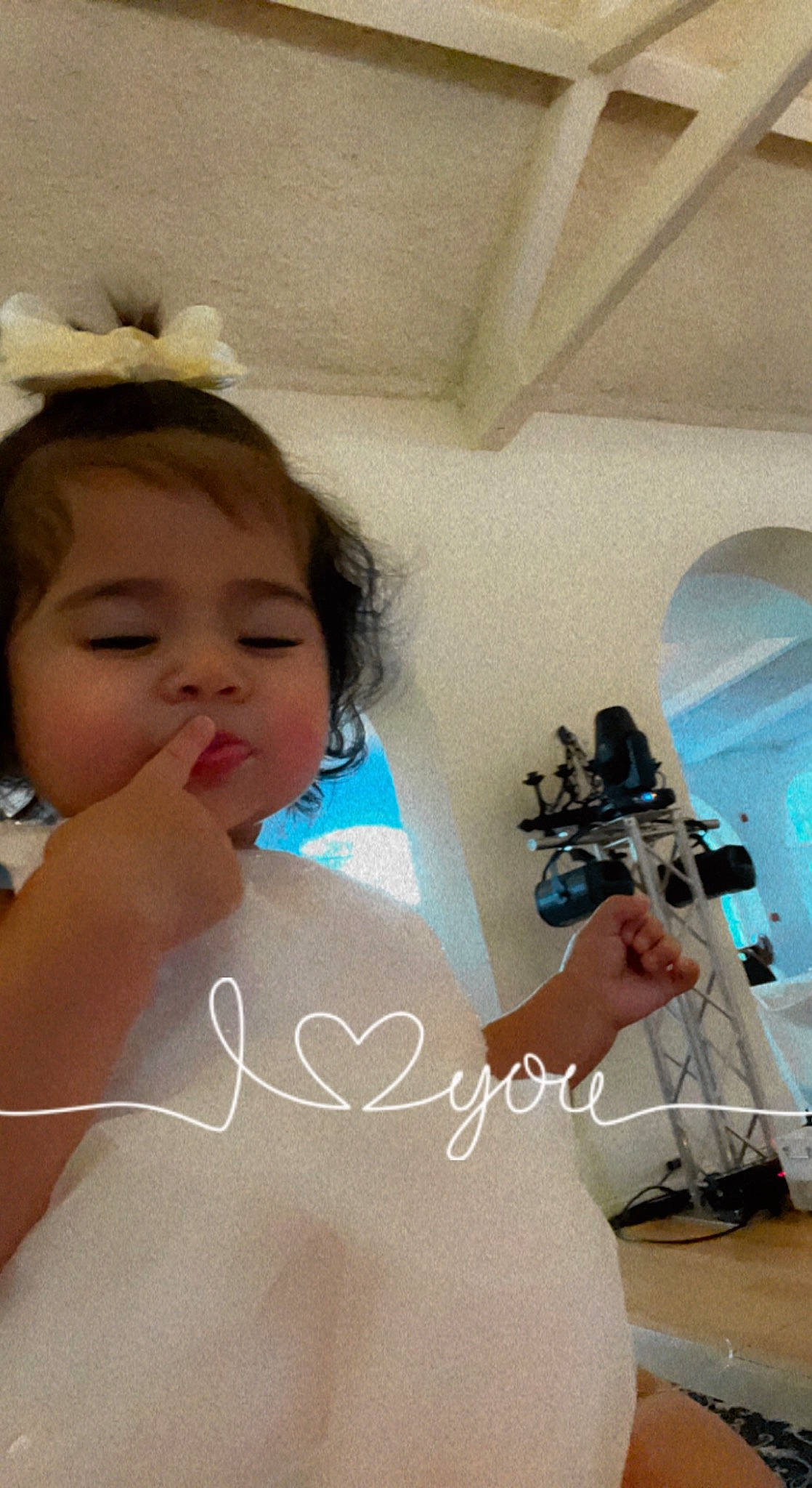 Kailani is registered to the contest to win money with this photo: abdomen, baby, beauty, black_hair, camera, chest, ear, eyelash, finger, gesture, happy, jewellery, nail, person, photographer, shoulder, skin, thumb, toddler, trunk