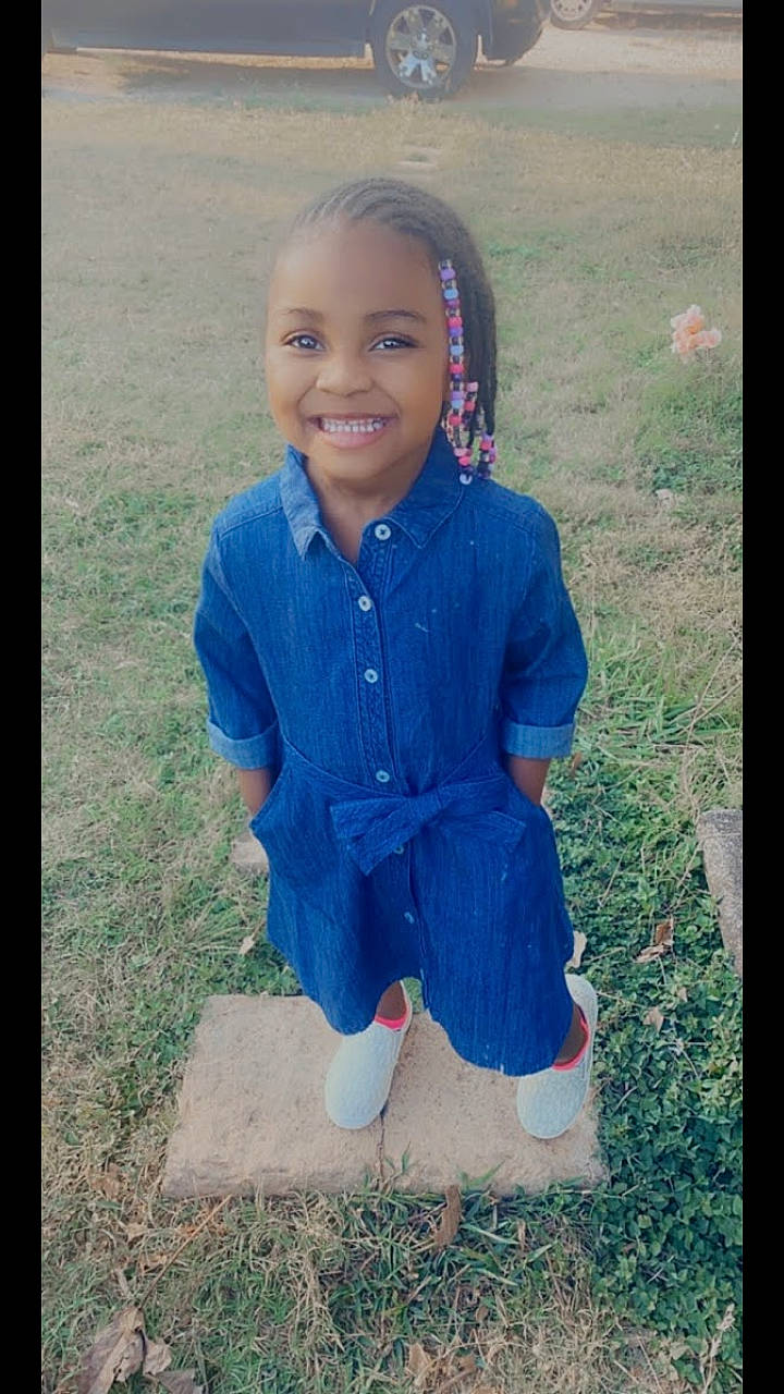 Cherish joined the competition — help win amazing prizes! adaptation, blue, cheek, child, cool, denim, eye, face, fun, grass, happy, head, joy, outerwear, people, person, play, portrait, sitting, smile