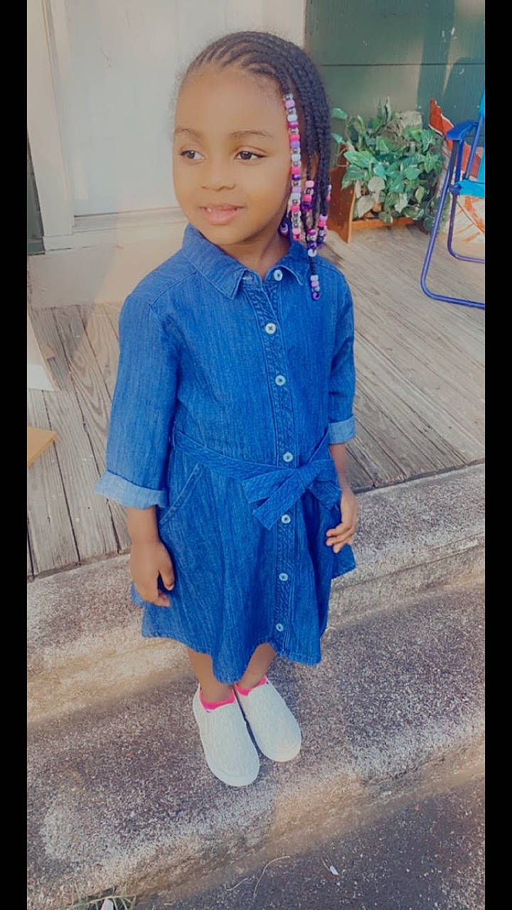 Cherish is registered to the contest to win money with this photo: blue, child, child_model, clothing, cool, denim, dress, face, fashion, footwear, head, human, jeans, outerwear, person, shoe, skin, smile, standing, textile