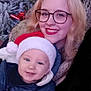 Lyam participe au concours pour gagner de l'argent avec cette photo : baby, cheerful, face, family, festive, frost, glasses, holiday, hoop_earrings, jackets, nature, outdoor, pine_tree, portrait, red_lipstick, santa_hat, seasonal, smile, winter_clothing, woman