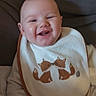 Daryl participe au concours pour gagner de l'argent avec cette photo : baby, bib, blanket, child, clothing, comfort, cozy, cushion, cute, face, fox_design, happy, head, indoor, infant, lying_down, person, portrait, smiling, soft_fabric