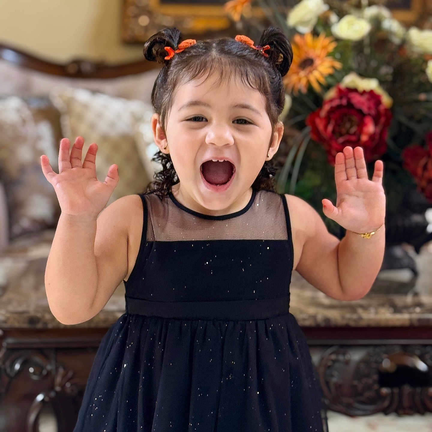 Jamilah joined the competition — help win amazing prizes! black_dress, bouquet, celebration, child, cute, decor, elegant, flowers, furniture, girl, hands_up, happy, indoor, joyful, orange_hair_ties, person, pigtails, portrait, smiling, young