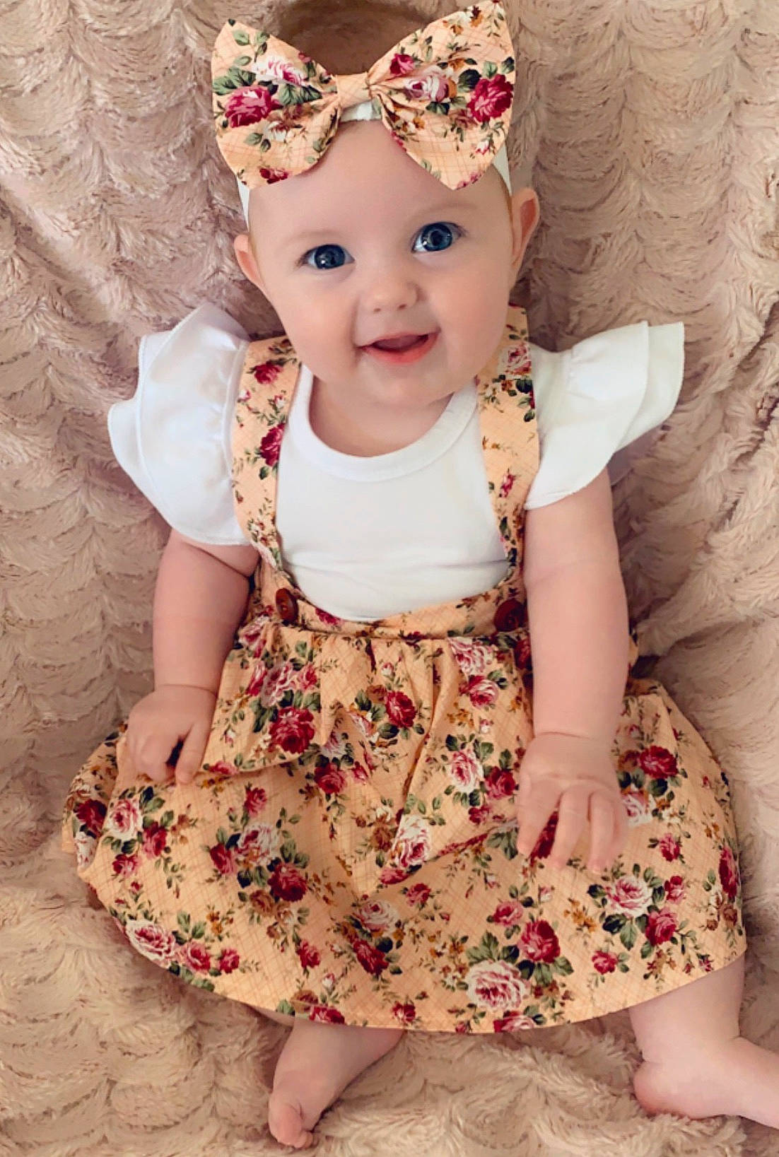 Ayda is registered to the contest to win money with this photo: baby, baby_toddler_clothing, cheek, child, child_model, clothing, design, dress, fashion_accessory, hair_accessory, head, headgear, headpiece, headwear, joy, pattern, person, pink, product, skin