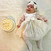 Milaniia participe au concours pour gagner de l'argent avec cette photo : baby, birthdaycake, blanket, bread, cake, clothing, cream, dessert, face, food, hat, head, hosiery, pancake, people, person, sitting, sleeve, sock, yawning