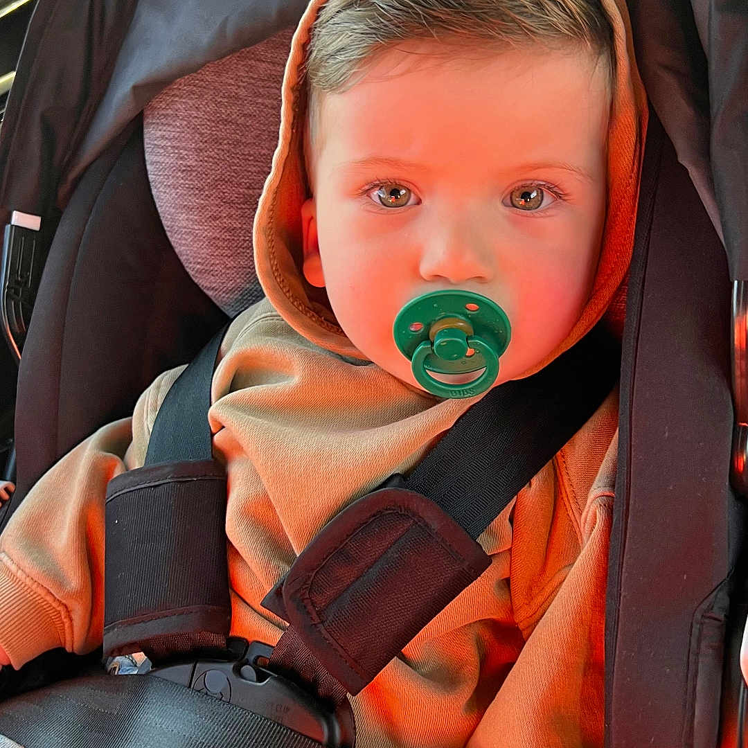 Aleks is registered to the contest to win money with this photo: accessories, baby, belt, bodypart, car, car_interior, carseat, cushion, face, finger, hand, head, homedecor, machine, person, photography, portrait, transportation, vehicle, wheel