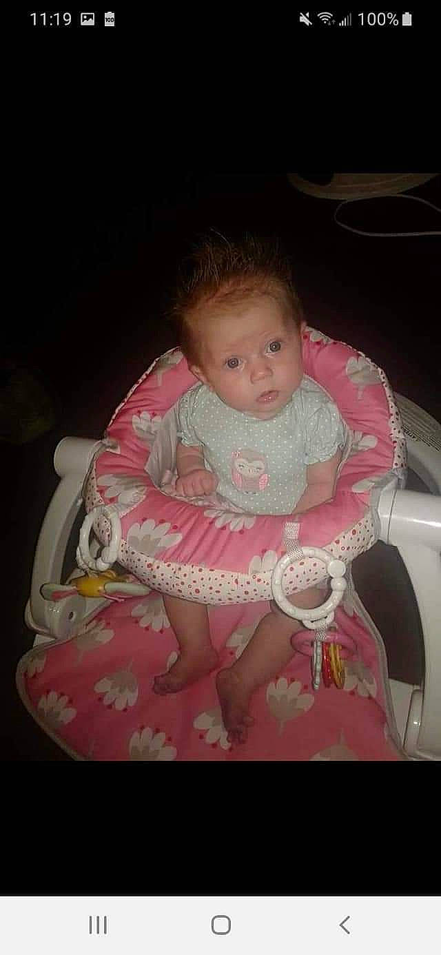 Jocelyn is registered to the contest to win money with this photo: baby, baby_carriage, baby_products, baby_toddler_clothing, car_seat, chair, cheek, child, comfort, dress, fun, hairstyle, lap, mouth, person, pink, sitting, skin, thigh, toddler