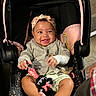 Ava joined the competition — help win amazing prizes! baby, infant, car_seat, headband, smile, toy, minnie_mouse, child, cute, happy, clothing, sitting, indoor, person, foot, hand, black_hair, pink, gray, playful