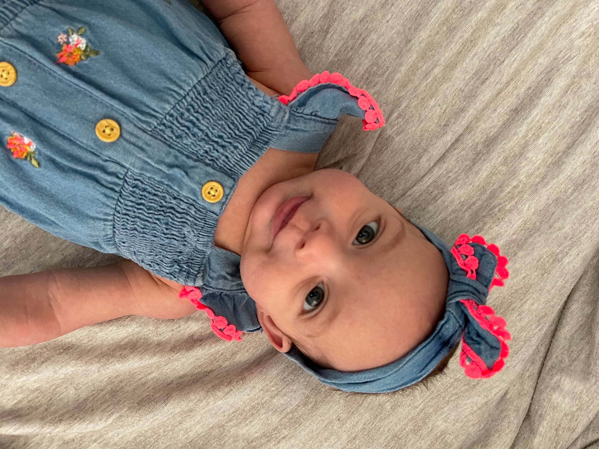 Lorelei is registered to the contest to win money with this photo: baby, baby_toddler_clothing, cheek, child, comfort, cool, finger, gesture, happy, headwear, human_body, joy, lip, mouth, nose, pattern, person, skin, sleeve, smile