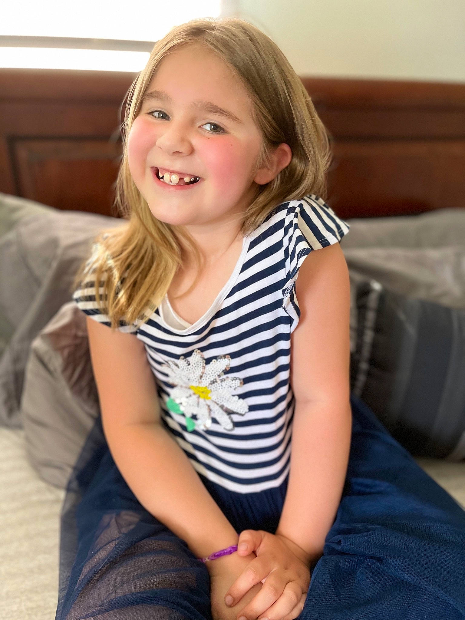 Nevaeh is registered to the contest to win money with this photo: arm, cheek, chin, clothing, comfort, eyebrow, finger, happy, iris, joint, joy, knee, leg, lip, neck, person, shoulder, skin, sleeve, smile