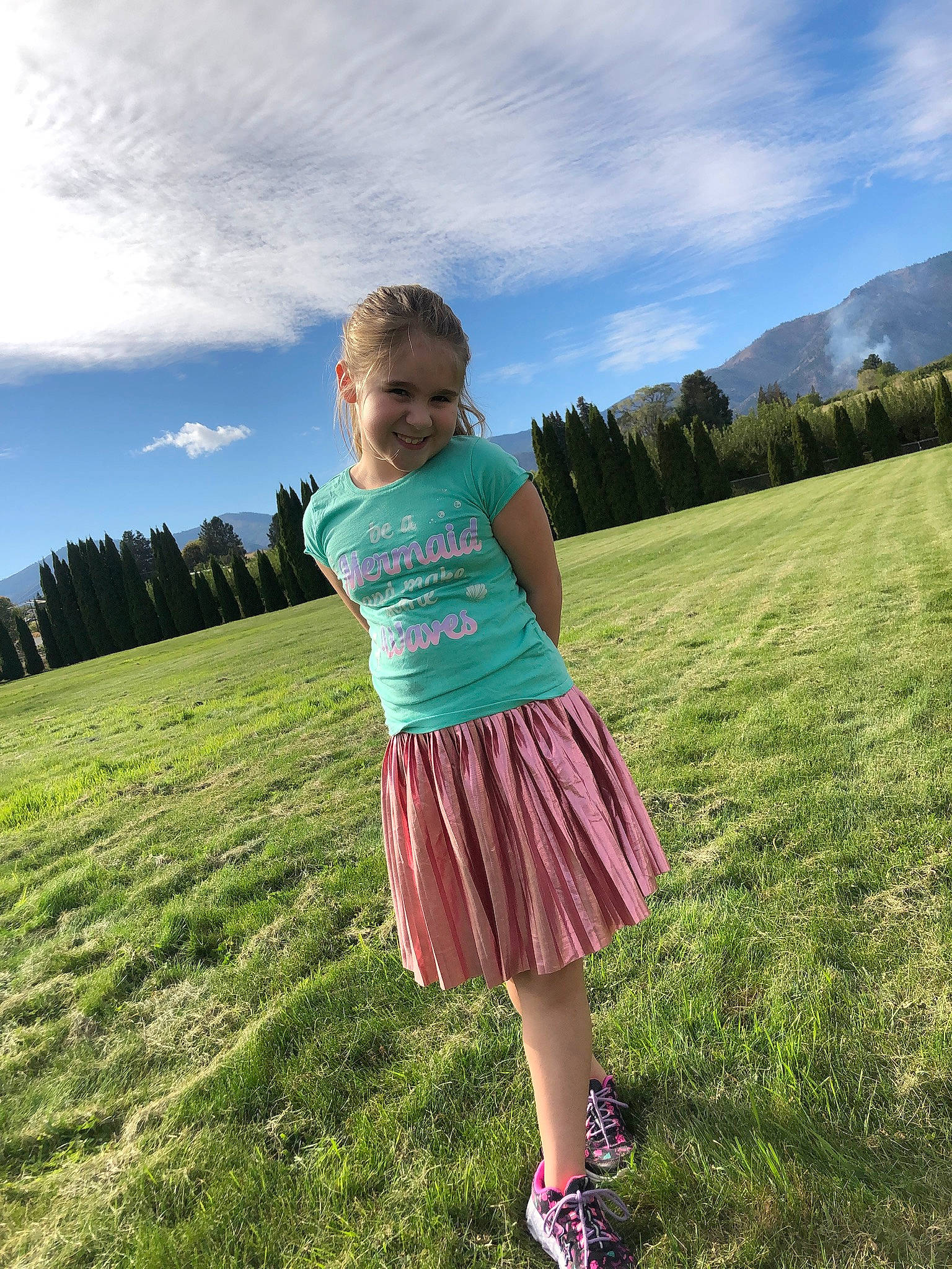 Nevaeh joined the competition — help win amazing prizes! cloud, ecoregion, flash_photography, fun, grass, grass_family, grassland, green, happy, joy, landscape, leisure, meadow, people_in_nature, person, plain, plant, shoulder, sky, smile