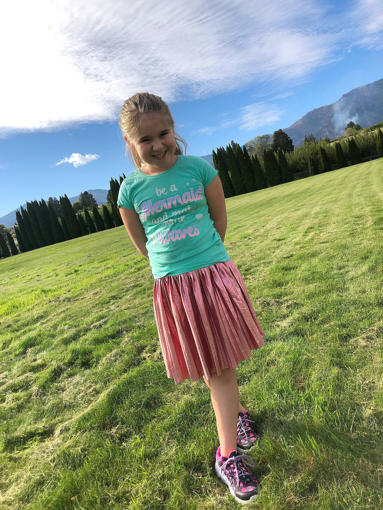 Nevaeh is registered to the contest to win money with this photo: cloud, flash_photography, fun, grass, grass_family, grassland, happy, horizon, joy, landscape, lawn, leisure, meadow, natural_landscape, people_in_nature, person, plain, plant, prairie, sky