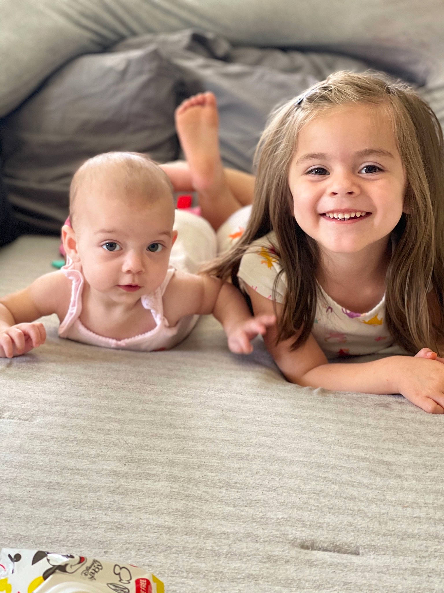 Novalee is registered to the contest to win money with this photo: baby, baby_toddler_clothing, clothing, face, facial_expression, finger, flooring, fun, gesture, grass, hairstyle, happy, head, human, joy, leisure, mammal, person, skin, smile