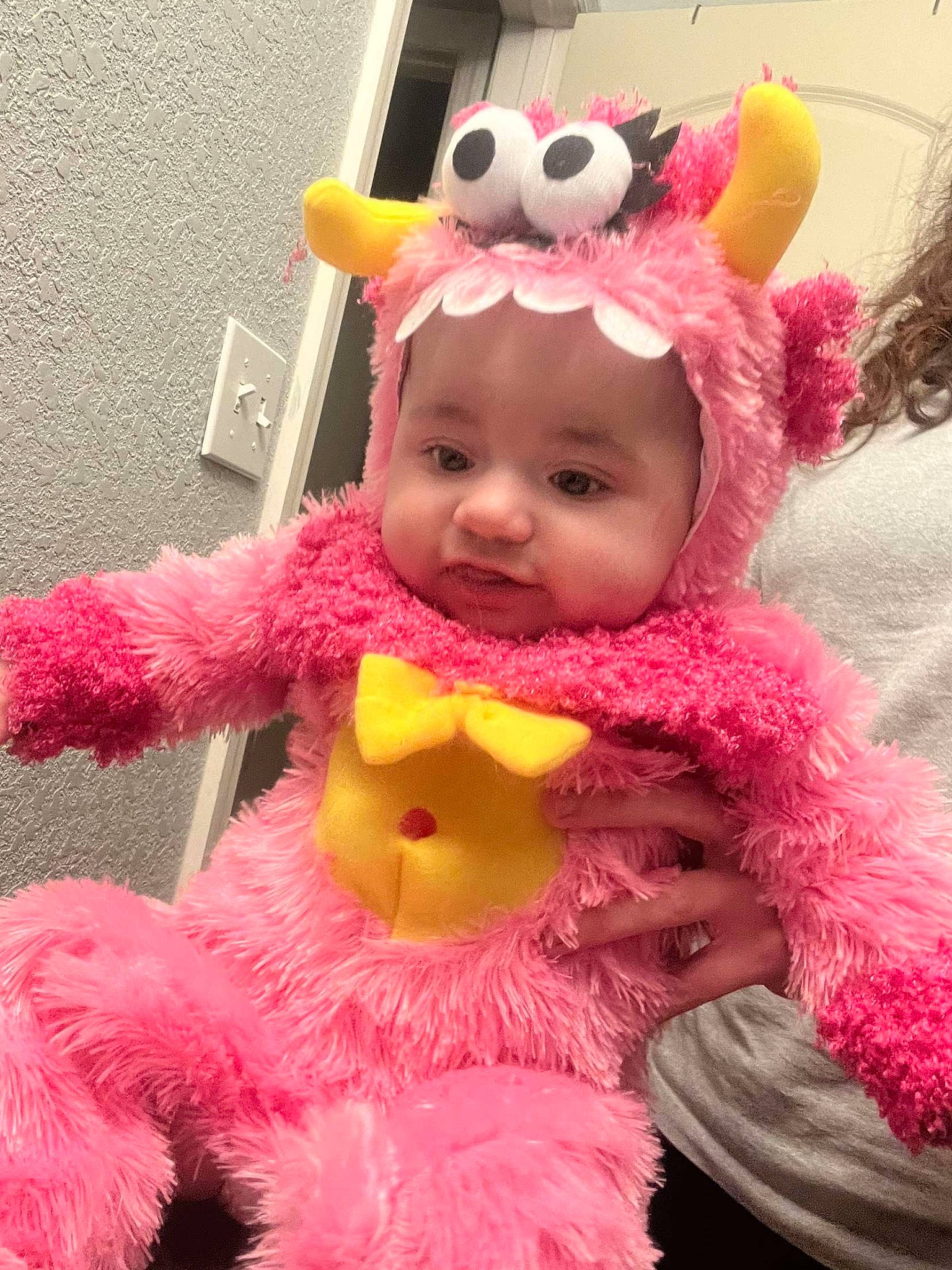 Alyzah joined the competition — help win amazing prizes! baby_toddler_clothing, child, costume, costume_hat, event, face, fun, fur, happy, headgear, headwear, magenta, mammal, party_supply, person, pink, plush, smile, stuffed_toy, textile