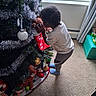Ja'Hkai joined the competition — help win amazing prizes! carpet, child, christmas, christmas_tree, curtain, family, festive, holiday, hugging, indoors, ornaments, playroom, santa, snowman, standing, teddy_bear, tinsel, toddler, toy, window