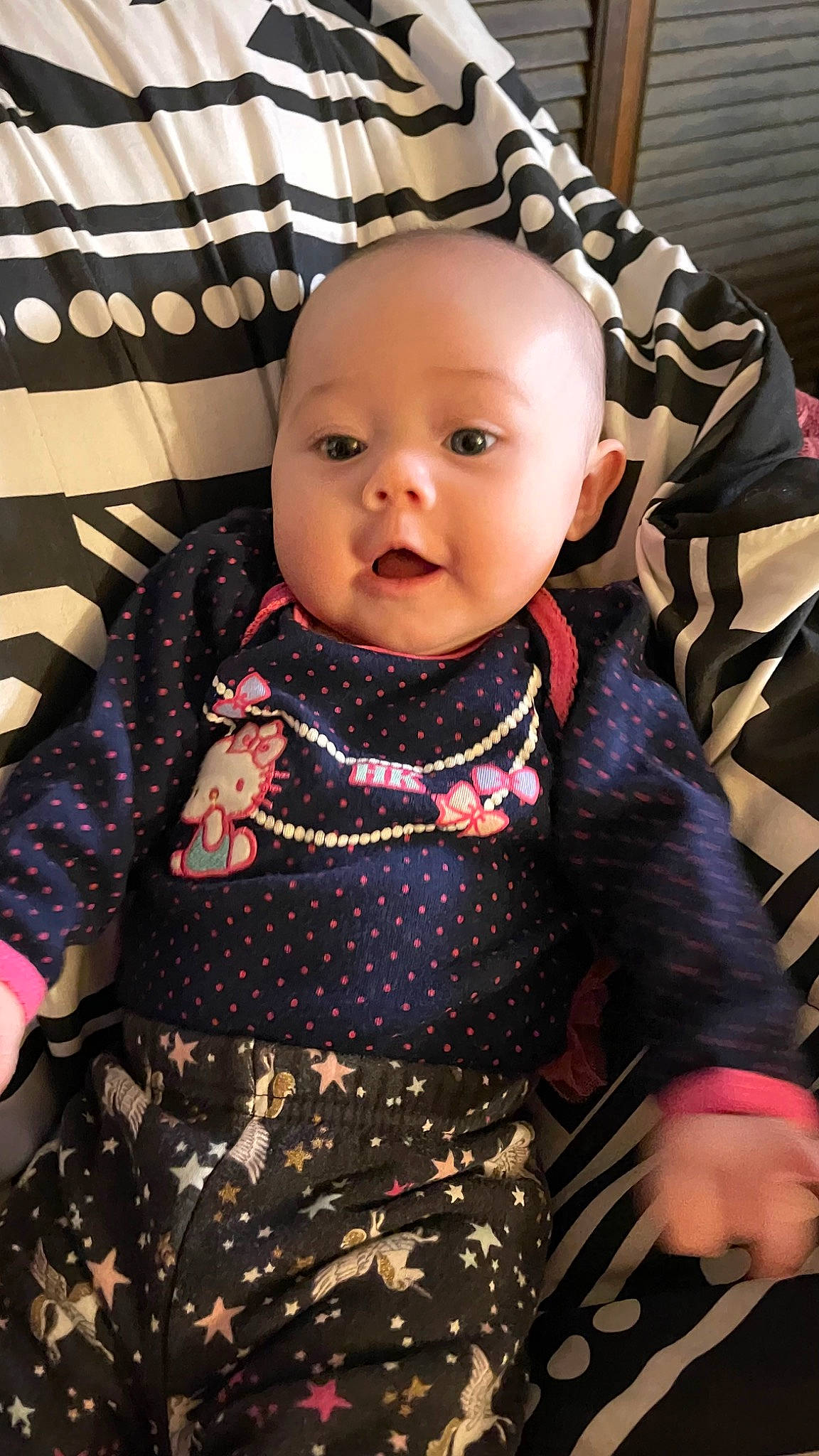 Skylar joined the competition — help win amazing prizes! baby, baby_products, baby_toddler_clothing, cheek, child, collar, dress, face, head, human_body, iris, lip, pattern, person, pink, plaid, sitting, skin, sleeve, t_shirt