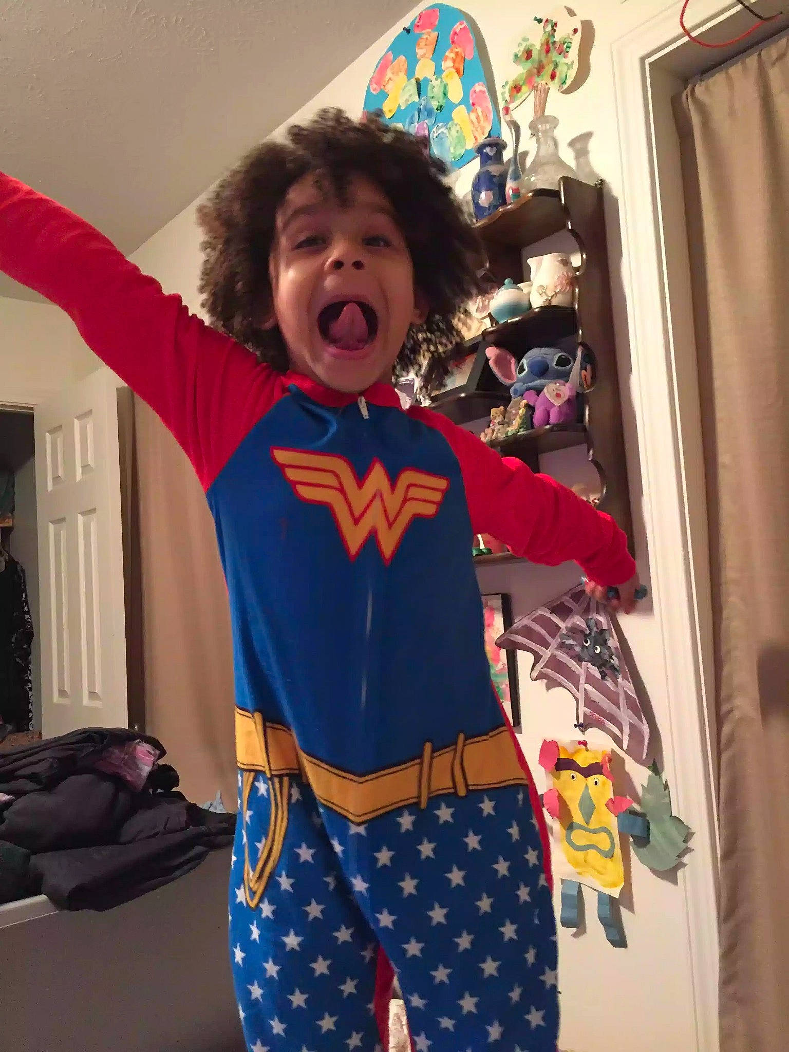 Skylah is registered to the contest to win money with this photo: child, clothing, costume, fictional_character, pajamas, person, smile, superhero, toddler