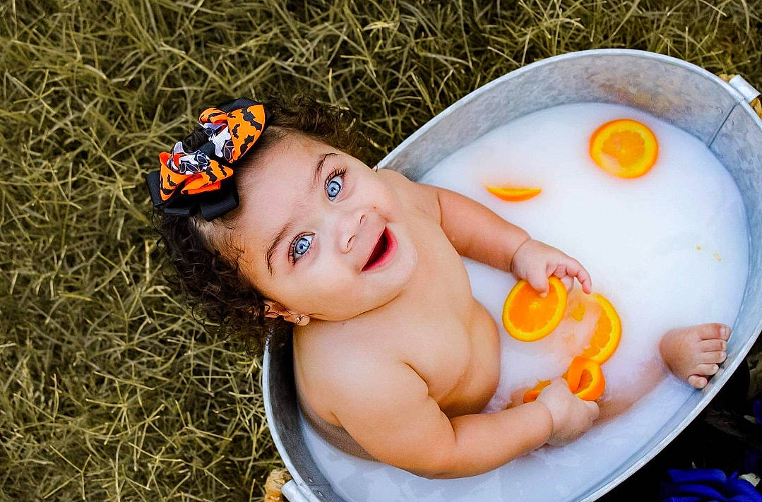 Raelynn joined the competition — help win amazing prizes! baby, baby_products, bath_toy, bathing, bathroom, cap, fun, grass, happy, leisure, orange, people_in_nature, person, recreation, rubber_ducky, skin, smile, summer, surprise, toddler