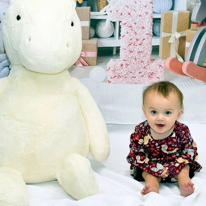 Elizabeth is registered to the contest to win money with this photo: baby, baby_toddler_clothing, child, fun, green, happy, human_body, pattern, person, photograph, pink, plush, sleeve, sock, stuffed_toy, surprise, t_shirt, teddy_bear, textile, toddler