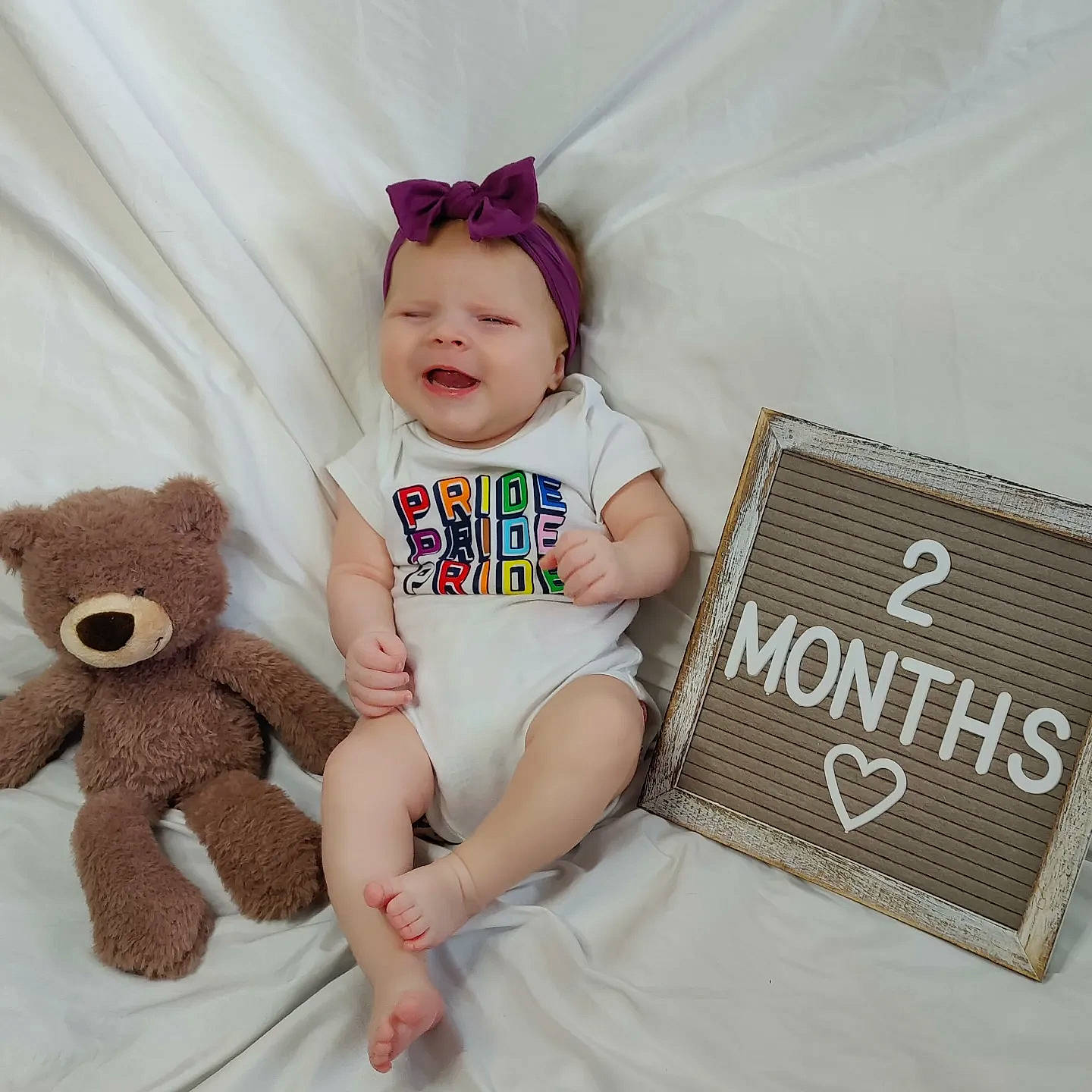 Elouise joined the competition — help win amazing prizes! baby, baby_sleeping, baby_toddler_clothing, child, font, happy, headgear, linens, mammal, people, person, pink, product, skin, sleeve, smile, t_shirt, teddy_bear, textile, toddler