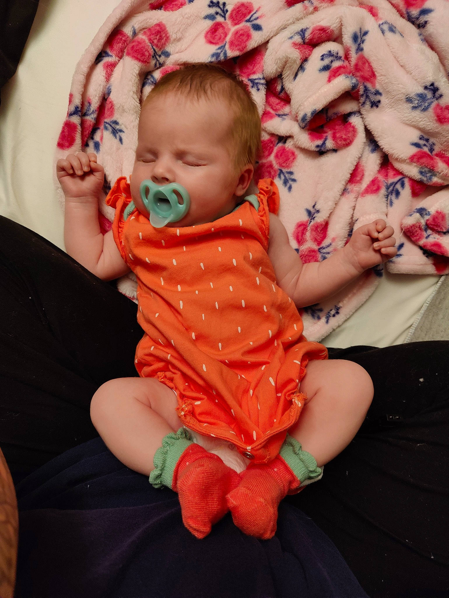 Elouise is registered to the contest to win money with this photo: baby, baby_toddler_clothing, cheek, child, comfort, couch, event, face, finger, fun, glasses, hand, happy, lap, mouth, orange, pattern, person, pink, skin