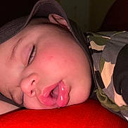 Michael joined the competition — help win amazing prizes! baby, sleeping, face, camouflage, cap, child, drool, closed_eyes, red_clothing, peaceful, portrait, skin, infant, cute, young_child, resting, indoors, closeup, headwear, soft_lighting