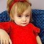 toddler, child, blonde_hair, red_dress, headband, blue_cushion, portrait, indoors, cute, young_child, fashion, lace, sitting, relaxed, person, face, skin, hand, expression, casual