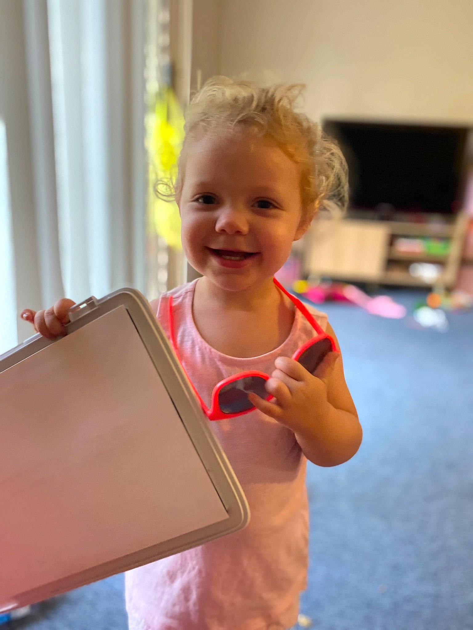 Amity is registered to the contest to win money with this photo: child, electronic_device, gadget, joy, person, play, smile, technology, toddler