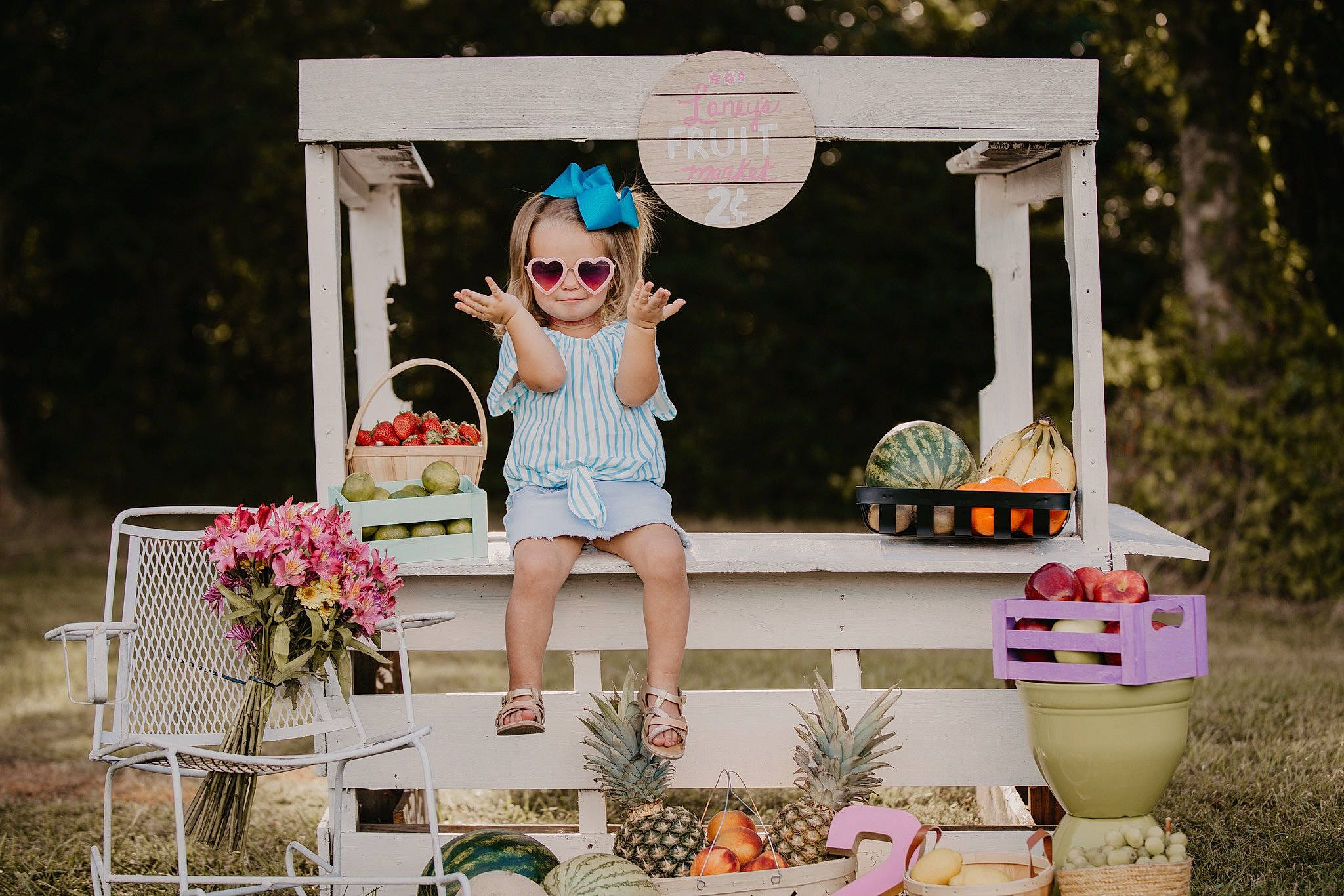 Laney is registered to the contest to win money with this photo: backyard, child, house, joy, party, person, photography, pink, plant, recreation, summer, table