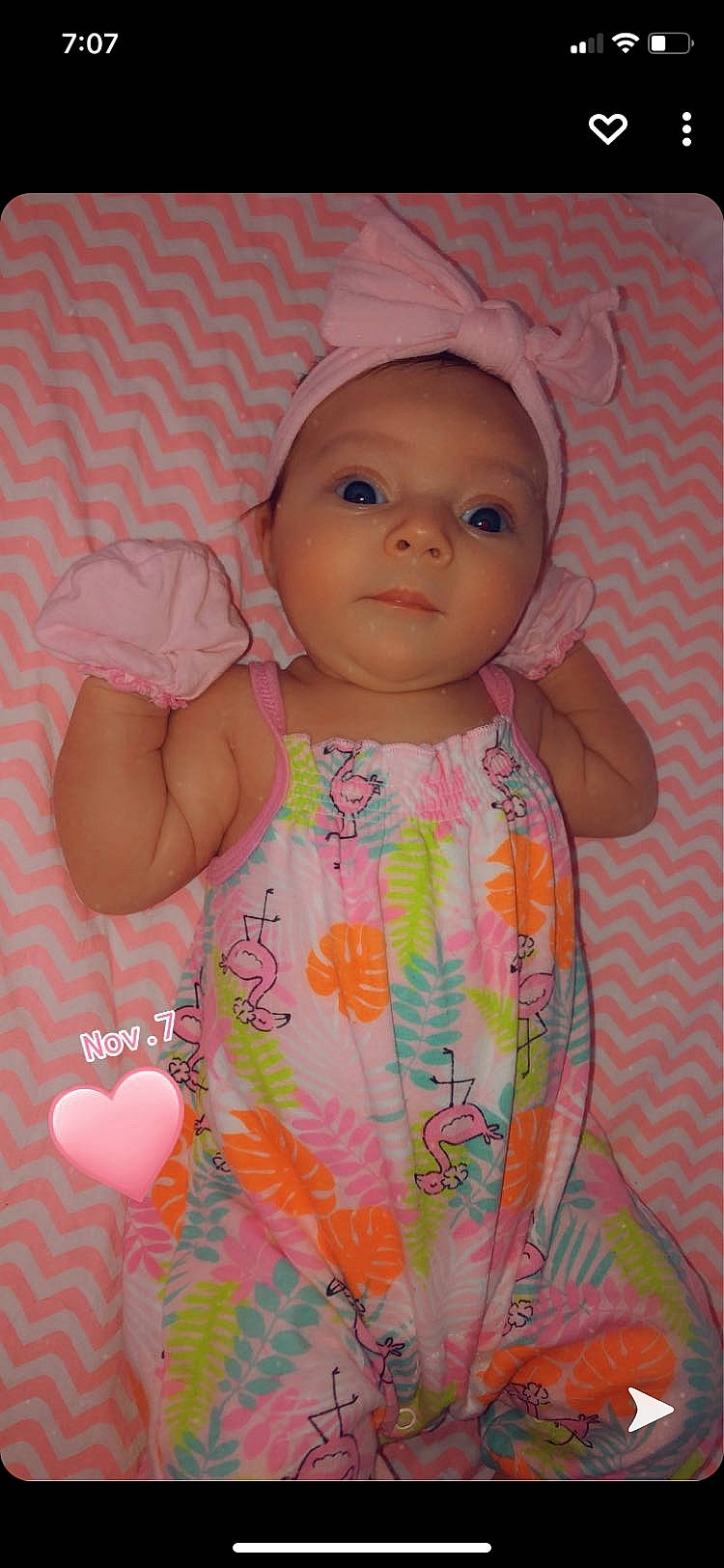 Hazelee is registered to the contest to win money with this photo: baby, baby_products, baby_toddler_clothing, balloon, cheek, child, day_dress, hair_accessory, headwear, heart, lip, peach, person, pink, skin, toddler