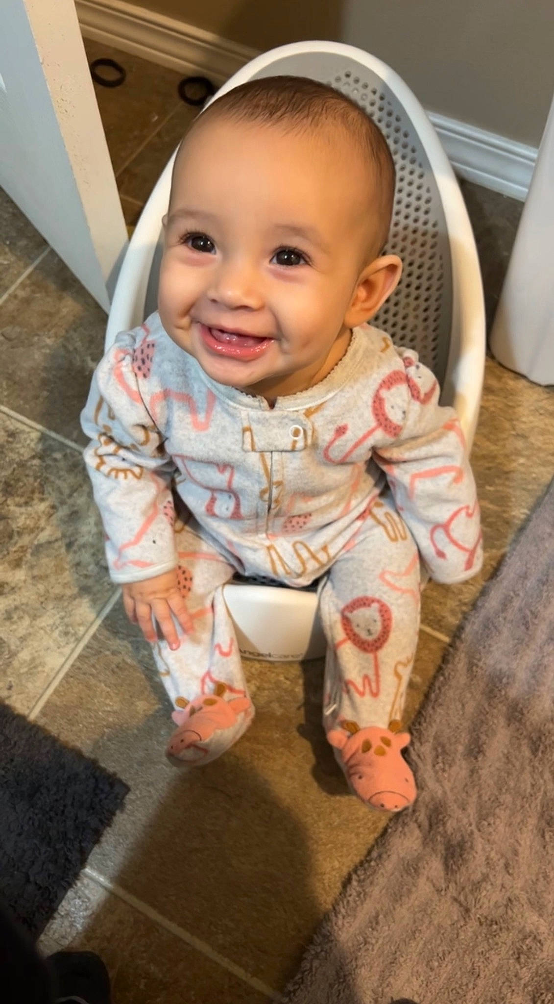 Davina is registered to the contest to win money with this photo: baby, baby_toddler_clothing, cheek, child, chin, comfort, eye, face, floor, flooring, happy, head, iris, joy, nose, person, sitting, skin, sleeve, smile