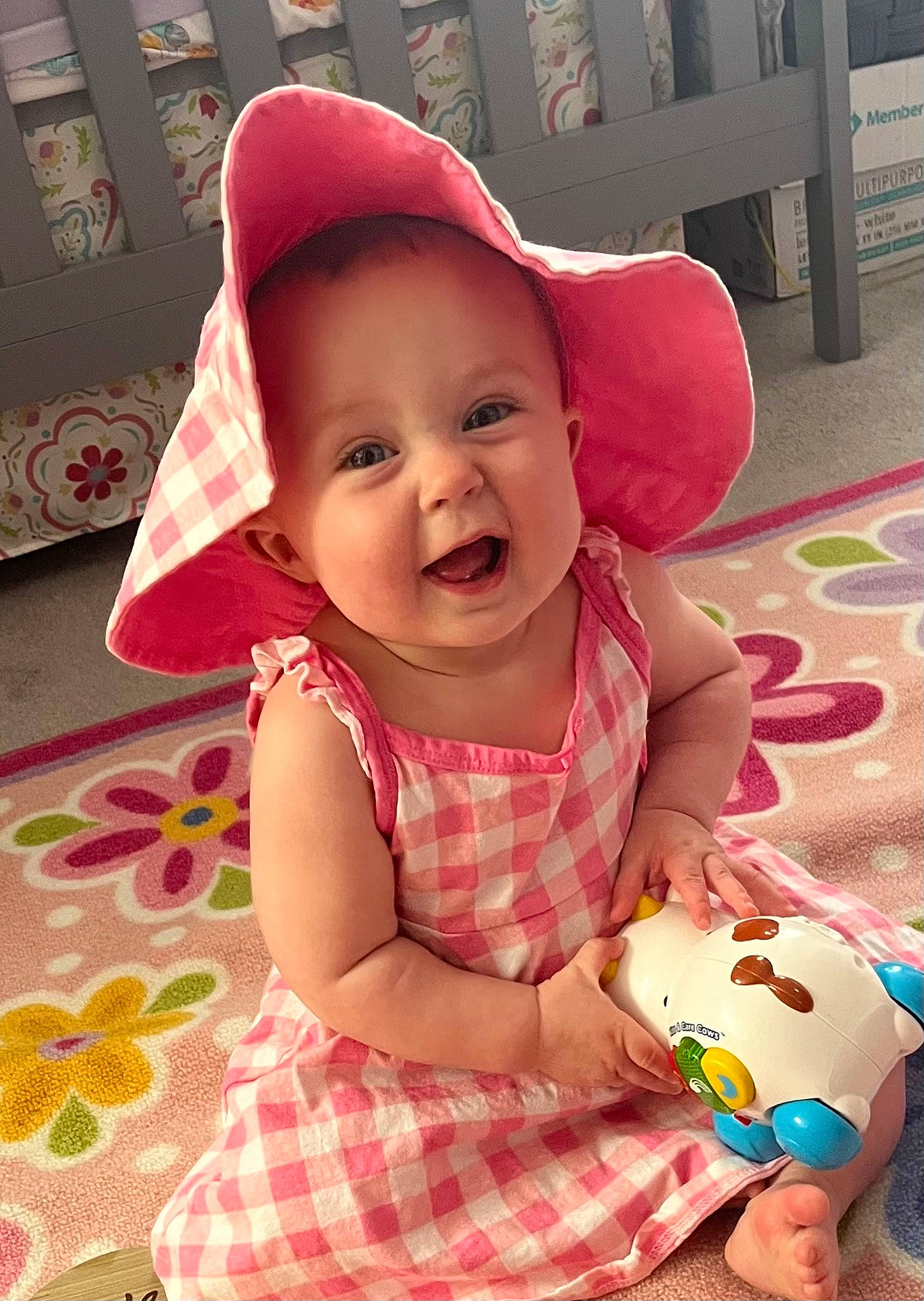 Elena joined the competition — help win amazing prizes! baby, baby_toddler_clothing, cap, cheek, child, facial_expression, fun, happy, head, magenta, pattern, person, pink, product, red, skin, smile, snapshot, toddler, toy