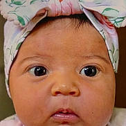 Charlie joined the competition — help win amazing prizes! baby, close_up, face, headband, bow, infant, cute, expression, skin, eyes, portrait, child, young, adorable, headwear, human, person, newborn, pink, curious