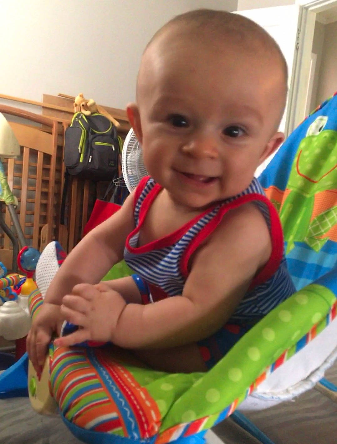 Tate is registered to the contest to win money with this photo: baby, baby_toys, cheek, child, ear, face, fun, joy, person, play, product, sitting, skin, smile, summer, toddler, tummy_time, vacation